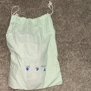 Off-White Cream Drawstring Bag with Blue Icons